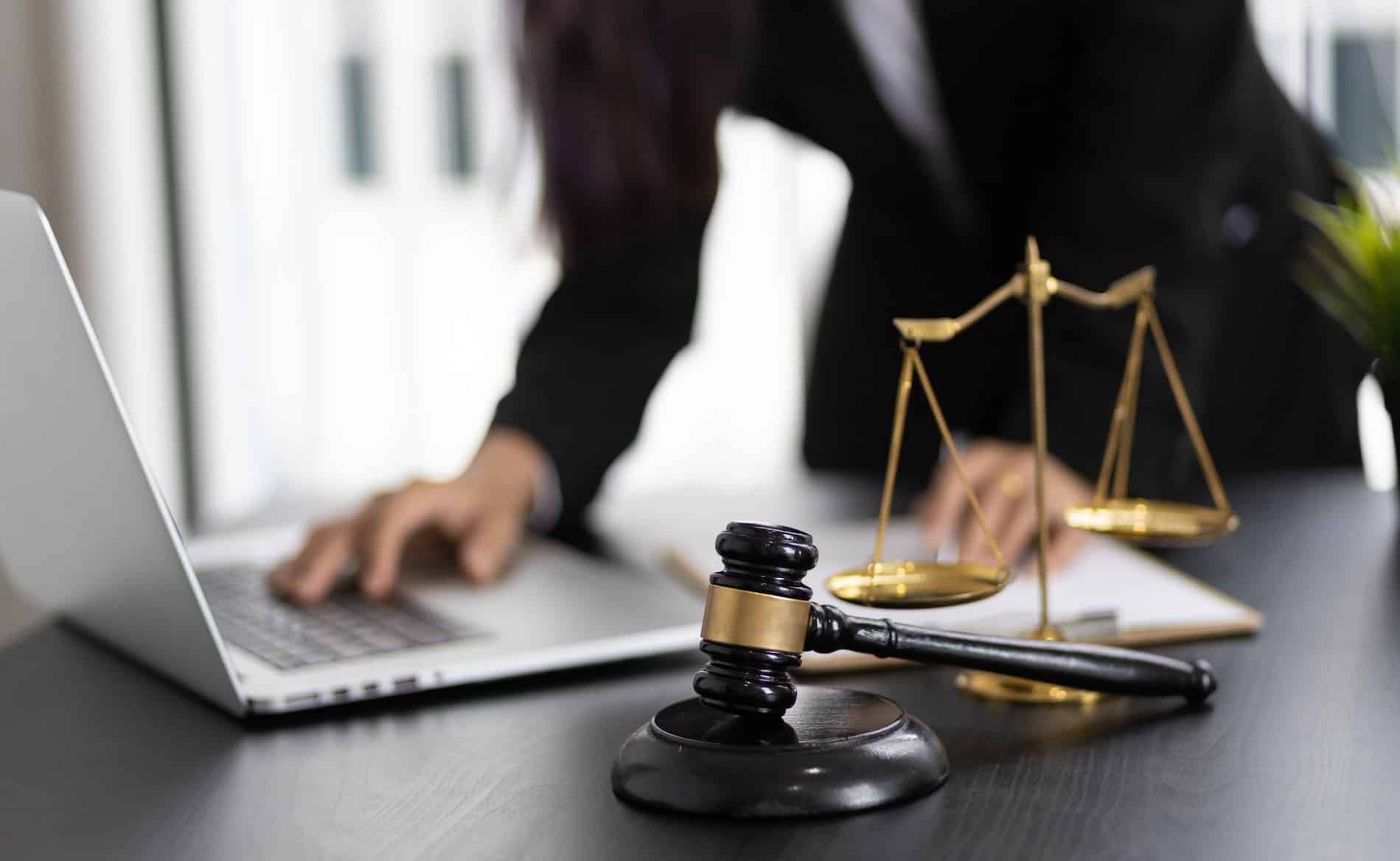 Computer with a gavel and legal scale